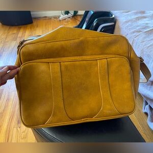 Vintage luggage bag in mustard/brown faux leather.
